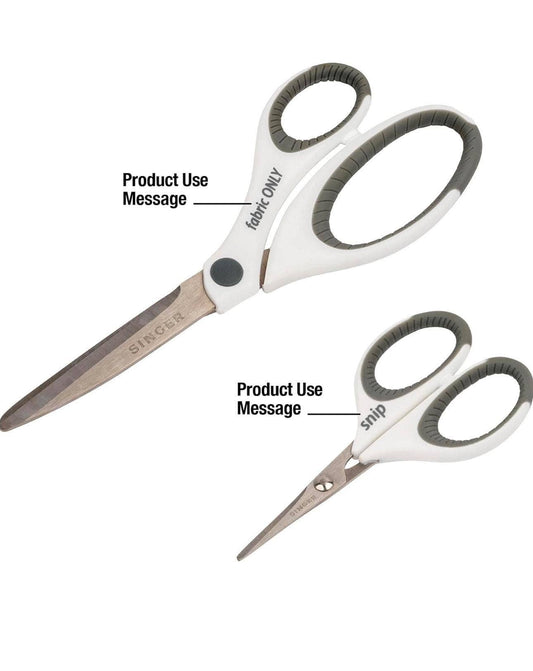 Two pairs of Singer scissors with labeled product use messages on a white background
